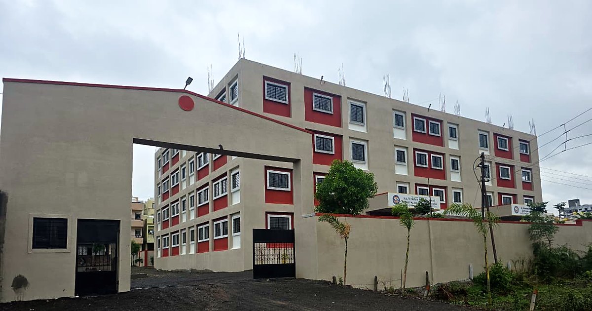 KNPIEMS academic block with open green surroundings